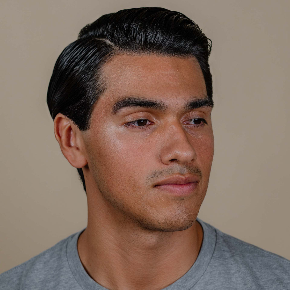 man with hair styled with Suavecito Firme Hold Styling Gel