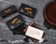 Suavecito Body Soap OG cinematic next to boxes