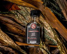Whiskey Bar Aftershave 3.3oz on plants
