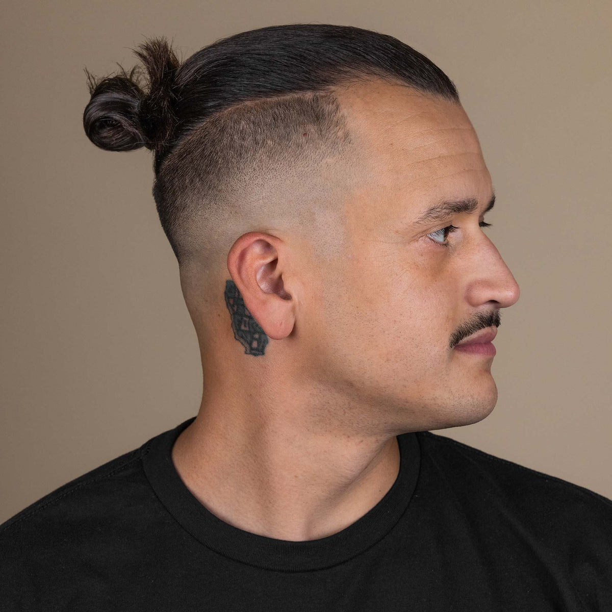 Man with hair styled with Suavecito Hair Cream