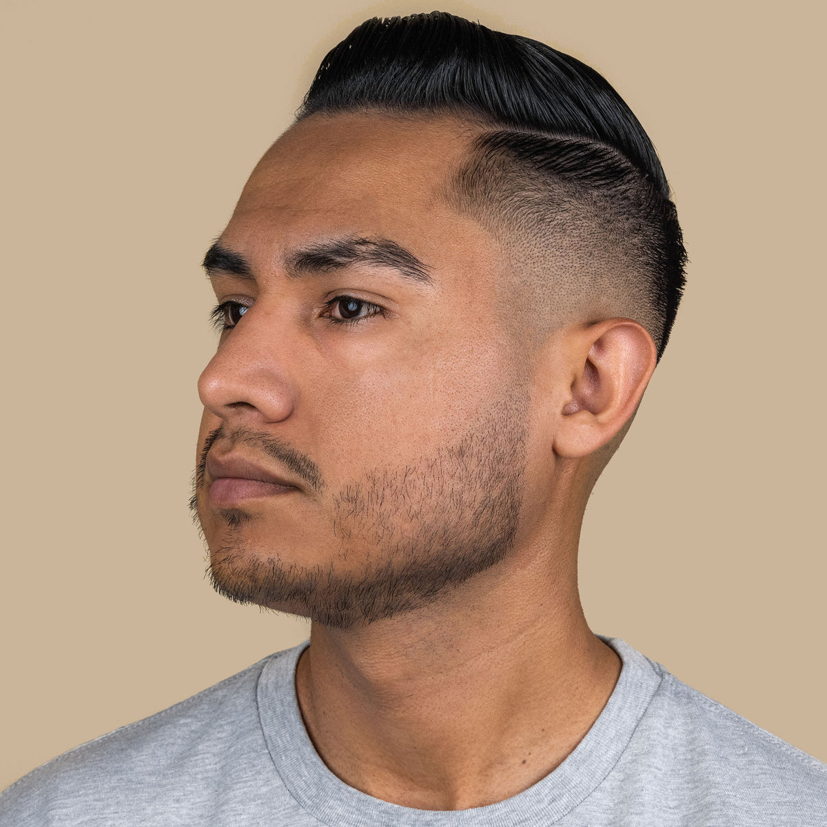 Man with hair styled used Suavecito water-based pomade