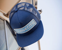 Load image into Gallery viewer, blue suavecito hat with white embroidered text and light blue background &quot;suavecito&quot;
