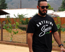 Load image into Gallery viewer, Anything for Suavecitas Tee - Model is wearing a size large tee.
