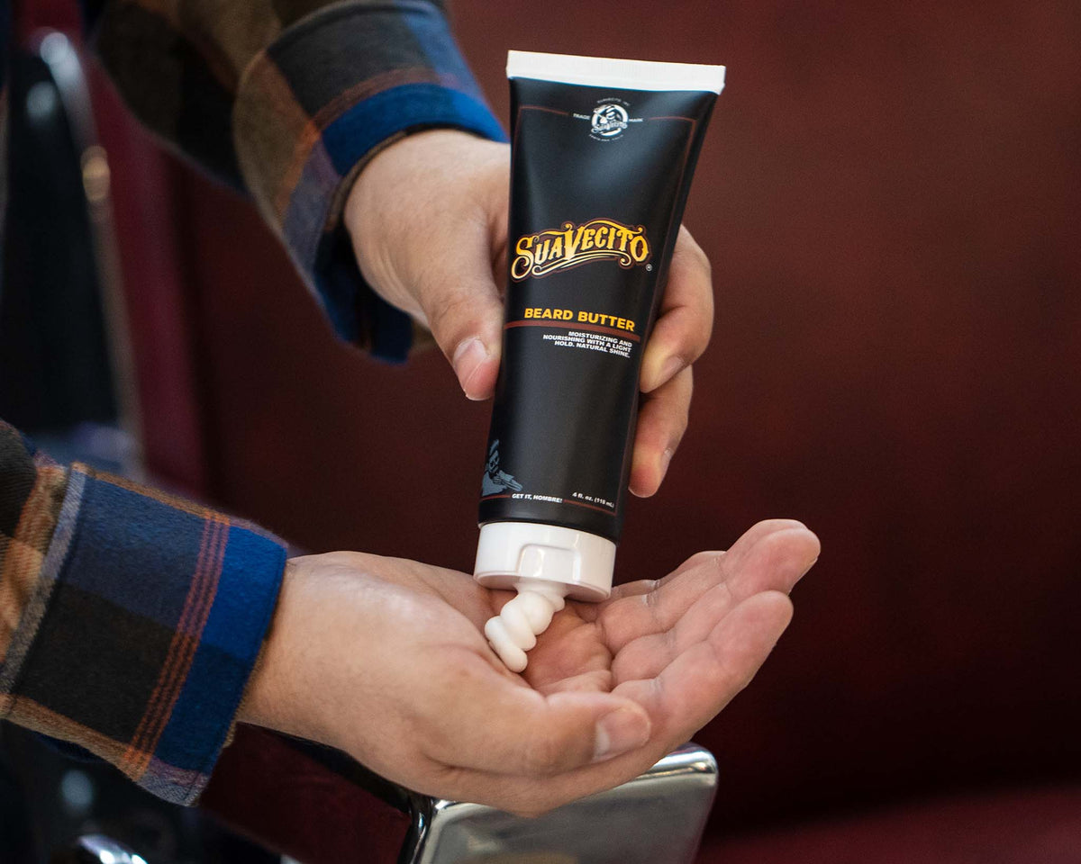 Suavecito Beard Butter being squeezed into hand