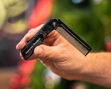 Black Pearl Folding Comb in hand cinematic outside
