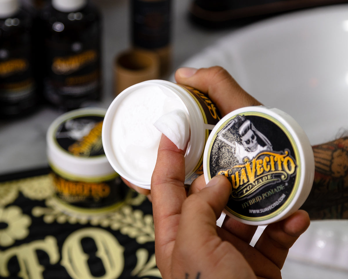 scooping hybrid pomade out of jar