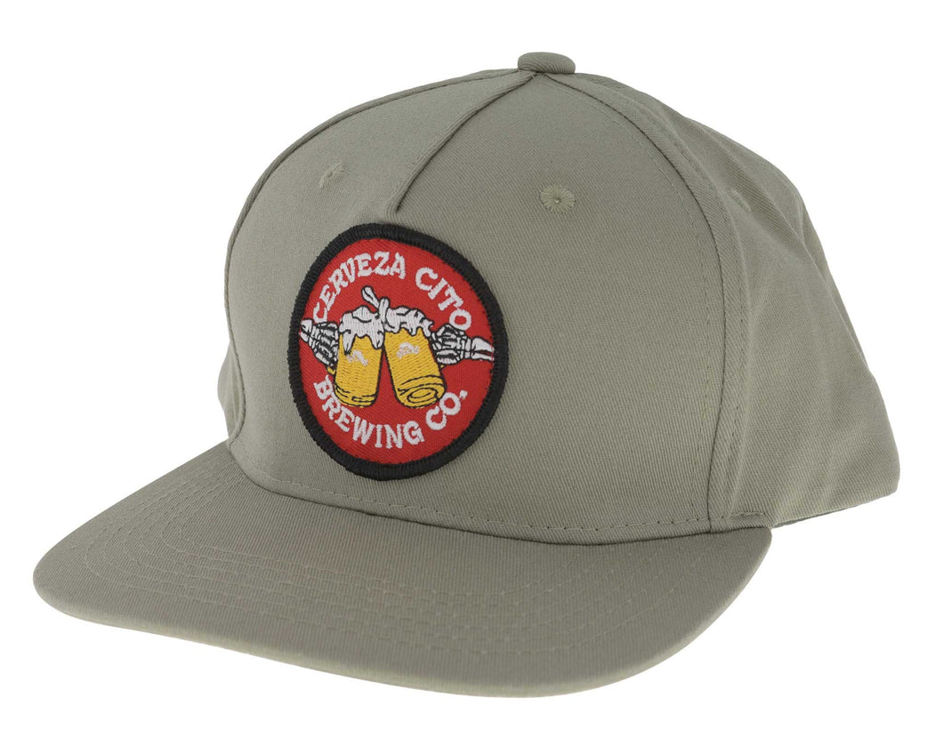 Salud Patch Hat. Gray cap with a Brewing Co logo on a white background