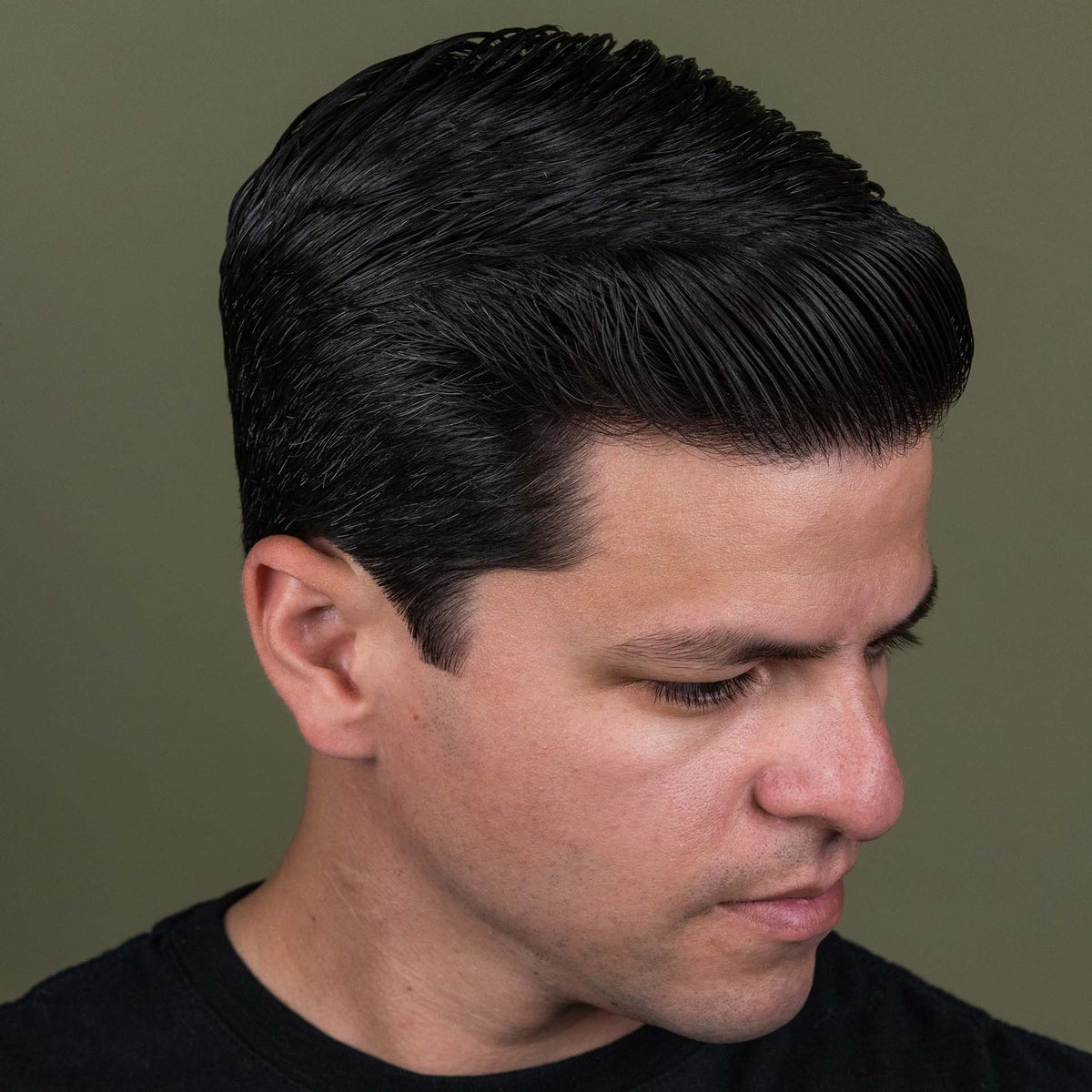 Man with hair styled with Suavecito Premium Blends Hair Pomade