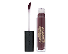 product shot of Bruja Lipgrip tube and applicator