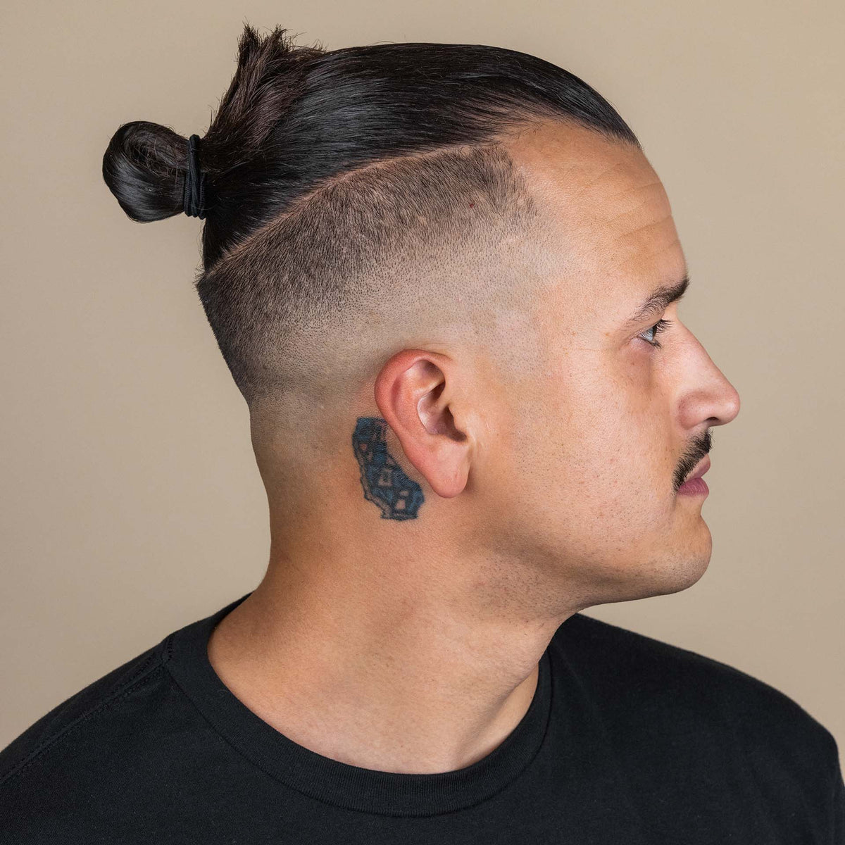 Man with hair styled with Suavecito Hairspray