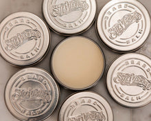 Beard Balm Original Fragrance - open tin surrounded by closed tins 