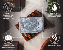 Bar of Suavecito soap with product features highlighted on a neutral background
