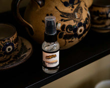 Suavecito Hand Sanitizer 1 fl oz angled left cinematic