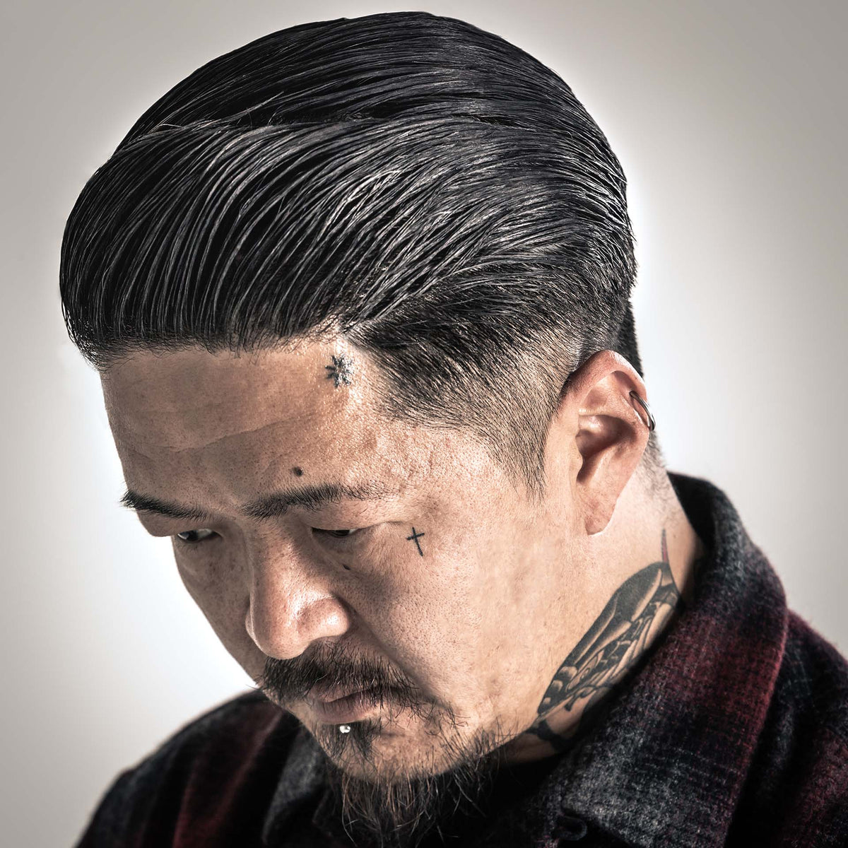 man with hair styled with Suavecito Oil Based Pomade