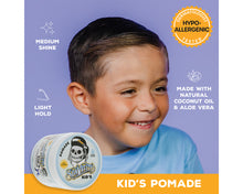Advertisement for a kid's pomade with a child and product packaging on a purple and orange background.
