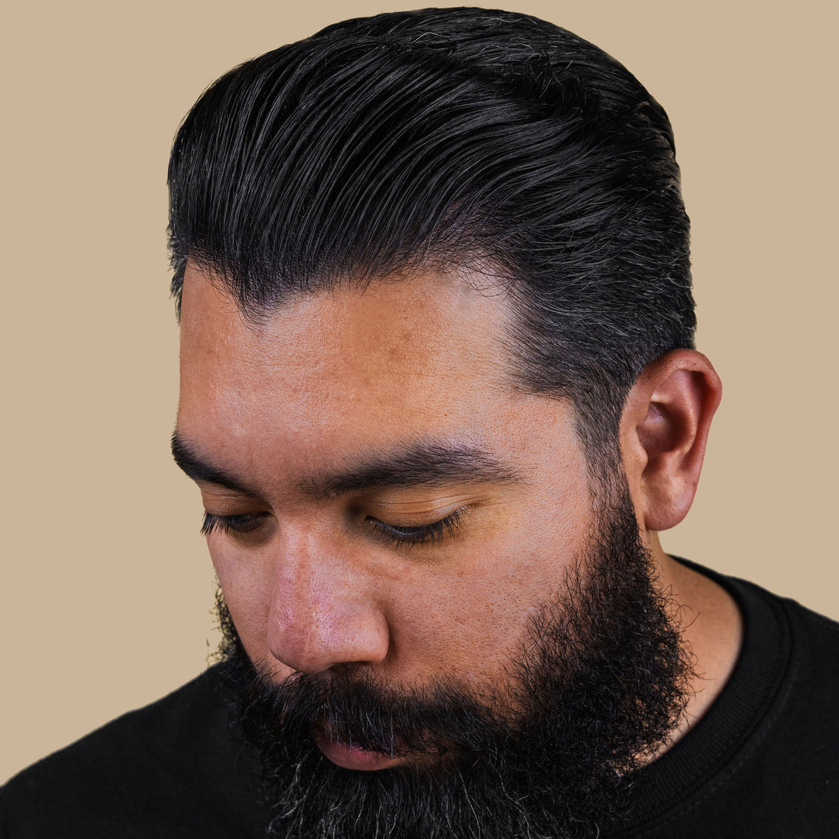 Man with hair styled used Suavecito water-based pomade