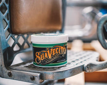 Matte Pomade 32 oz Tub on a barber chair