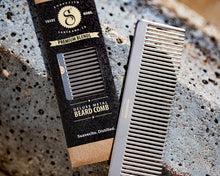 Load image into Gallery viewer, Deluxe Metal Beard Comb - cinematic next to packaging
