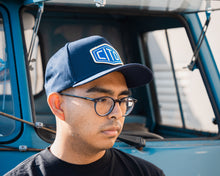 Load image into Gallery viewer, man wearing - blue suavecito hat with white embroidered text and blue background &quot;cito&quot;
