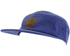 blue suavecito hat with black text and brown background 