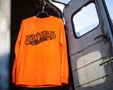 Load image into Gallery viewer, OG Safety Orange Long Sleeve Tee - Lifestyle
